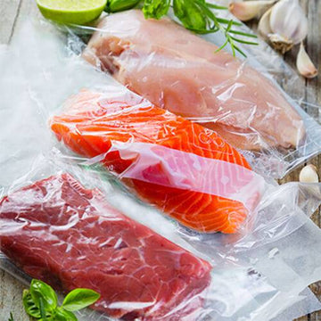 red meat, salmon and chhicken vacuum sealed in bags