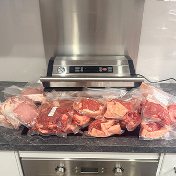 Commercial vacuum sealer with vacuum sealed meat. Preservac VacBloke