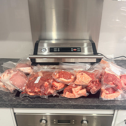 Commercial vacuum sealer with vacuum sealed meat. Preservac VacBloke