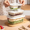 Set of 3 glass vacuum canisters being stacked in a kitchen