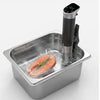 Salmon fillet with rosemary being cooked in a sous-vide machine.